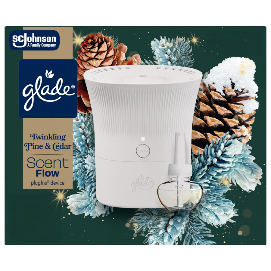 Glade Scent Flow starter device and refill shown against pinecone and frosted evergreen holiday illustration.