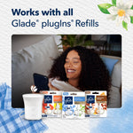 Glade ScentFlow device shown with several compatible Glade plugIns refill packages and relaxed person on couch promoting compatibility