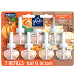 Glade branded blister pack showing seven transparent scented oil plug-in refills with pumpkin and vanilla imagery
