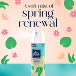 Glade soft mist room spray can in front of pastel floral background with text reading a soft mist of spring renewal