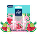 Glade limited edition plug-ins refill twin pack with watermelon and cucumber graphics and two clear scent bottles on illustrated background.
