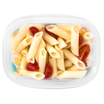 Top-down view of a clear Gladware rectangular container with geometric accents, filled with penne and cherry tomatoes