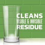 Empty drinking glass illustration on green tiled background with text ‘Cleans Visible & Invisible Residue’