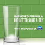 Tall clear drinking glass against a green tiled background with text about improved formula for better shine and dry