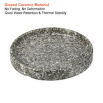 Speckled marble-effect glazed ceramic saucer with overlay text describing glazed ceramic material benefits