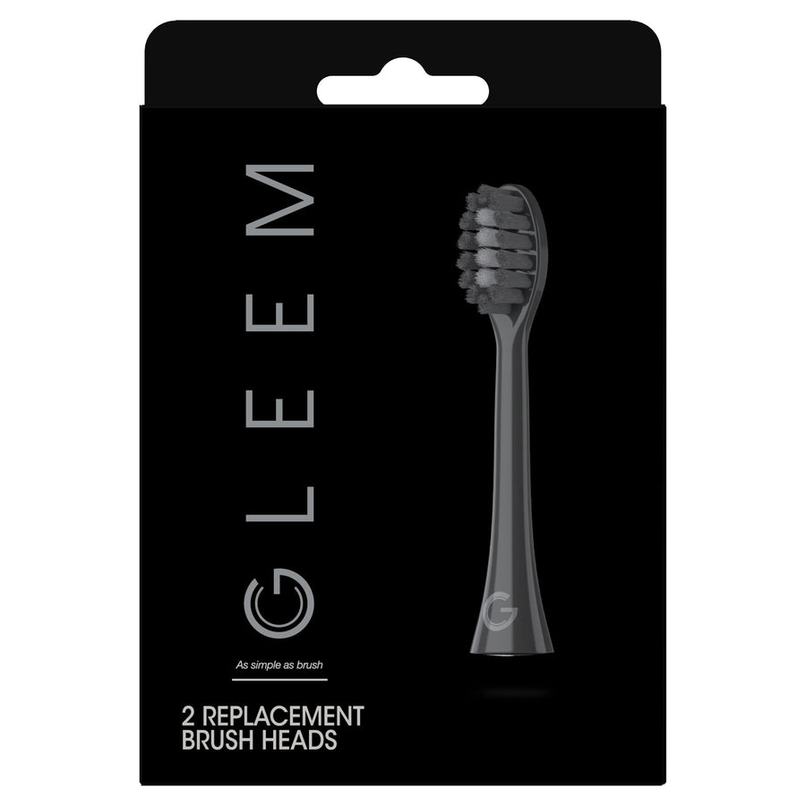 Black Gleem retail card showing a single black replacement brush head illustration and product name