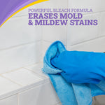 Close-up of gloved hand wiping tile grout with a blue cloth alongside text about stain removal