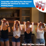 Four women using a wooden shot ski, tipping small red plastic cups to drink; inset shows stacked mini red cups