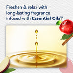 Stylized droplet splashing into golden oil beneath text about long-lasting fragrance infused with essential oils