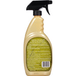Rear view of a Granite Gold Shower Cleaner bottle showing product information label and black trigger