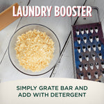 Bowl of grated Fels‑Naptha shavings beside a grater and a soap bar with headline laundry booster and usage instruction text.