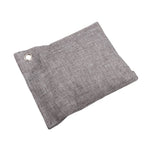 Flat gray textured air-purifying sachet with metal grommet on white background