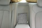 Gray woven purifier bag placed on a car center console compartment