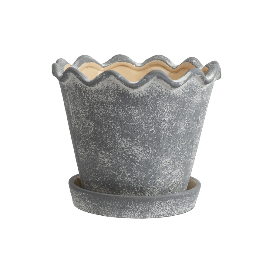 Gray ceramic planter with scalloped wavy rim and matching saucer, textured weathered finish