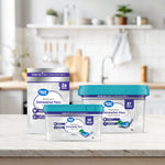 Kitchen lifestyle scene showing three Great Value dishwasher pac containers and a standing pouch on a marble countertop