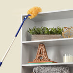 Extended Great Value duster with yellow fluffy head dusting top shelf of a bookcase in a home scene