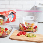 Kitchen scene with a clear Great Value gallon zipper bag holding mixed fruit next to its red product box