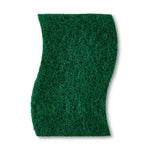 Top-down view of a green abrasive scouring side of a contoured scrub sponge on a white background