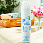 Great Value Linen Fresh aerosol air freshener can displayed upright on a table with blurred home decor in background