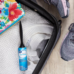 Great Value travel lint roller placed inside an open suitcase alongside clothing and a shoe, lifestyle packing scene.
