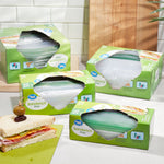 Kitchen scene with multiple Great Value sandwich bag boxes and an open sandwich visible next to the packages