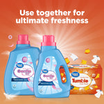 Promotional graphic showing two bottles of Great Value Gentle fabric softener alongside a box of Great Value Tumble dryer sheets on an orange burst background.