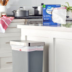 Kitchen scene with Great Value Strong Flex 13 gallon box on counter and a lined trash can in foreground