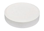 Close-up white circular tablet on a plain background representing a single toilet bowl bleach tab