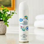 Great Value Tranquil Ocean Waves aerosol air freshener can shown upright on a countertop with blurred plant and towels in background