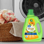 Great Value Ultimate Fresh laundry detergent bottle placed in a laundry scene with woven basket, towels and front-load washer