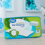Great Value wet mopping cloths package placed on a countertop with blurred home decor in background, front label visible