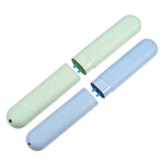 Two speckled toothbrush travel cases, green and blue, shown partly separated to reveal insert connection with blue arrow indicators.