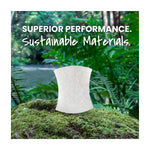 Single white scrub sponge showcased on a mossy forest background with text “Superior Performance. Sustainable Materials.”