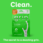 Green ad graphic with a Grin Clean pouch centered and headline 'Clean.' plus tagline 'The secret to a dazzling grin.'