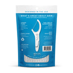 Rear view of blue Grin pouch showing product features, barcode and clear window with floss picks