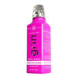 Angled magenta Grin oral rinse bottle with visible front logo and ingredient text.