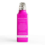 Magenta Grin oral rinse bottle showing ingredient panel and usage instructions.