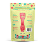 Back of Grin Kiddo packaging showing a single pink tongue cleaner, product copy and a small clear window revealing tools inside.