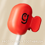 Close-up product shot of a red Grin brushcap clipped onto a toothbrush handle against a neutral backdrop and tagline text