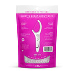 Back of a magenta Grin Smooth floss picks pouch with product features text, barcode and clear window showing picks
