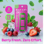 Grin Strips berry minty three-pack blister displayed with berries, mint leaves and icy background.