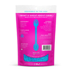 Rear view of pink Grin pouch with product information, barcode and a window revealing blue tongue cleaner straps