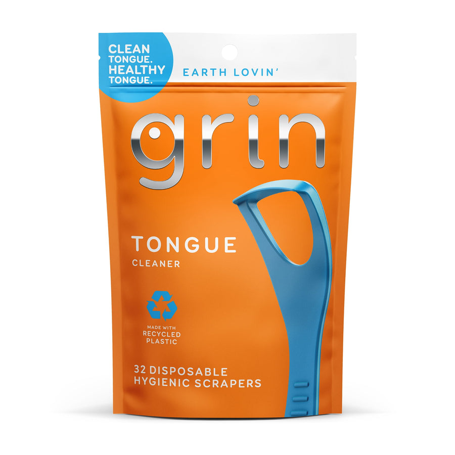 Orange resealable pouch of Grin tongue cleaner with a large blue scraper graphic