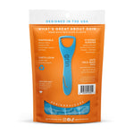 Rear view of orange Grin tongue cleaner pouch showing product info and a blue scraper illustration