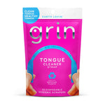 Bright pink resealable pouch of Grin Tongue Cleaner Strap showing blue strap illustration and recycled-plastic icon