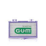 Close-up of a translucent purple G·U·M wax case with the G·U·M logo printed on the white insert.
