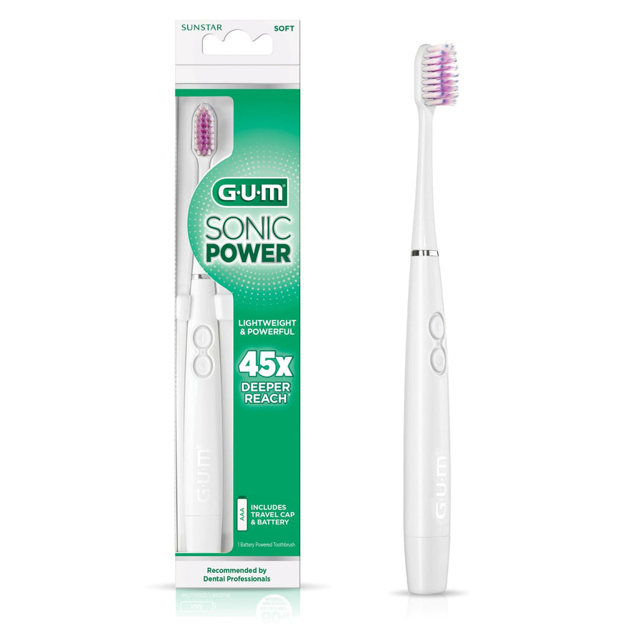 G•U•M Sonic Power battery toothbrush in white shown next to its green-and-white retail blister packaging.