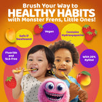 Promotional graphic with two children brushing, monster character and colorful benefit bubbles highlighting vegan, hydroxyapatite and xylitol.