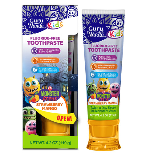Guru Nanda Kids fluoride-free toothpaste tube and retail box showing colorful monster characters and strawberry mango branding.