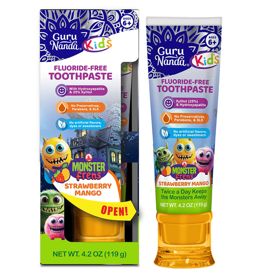 Guru Nanda Kids fluoride-free toothpaste tube and retail box showing colorful monster characters and strawberry mango branding.